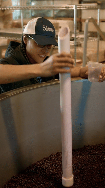 winemaker sampling wine