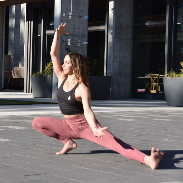 Instructor doing yoga on the terrace.