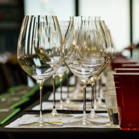 Wine glasses lined up in a row.