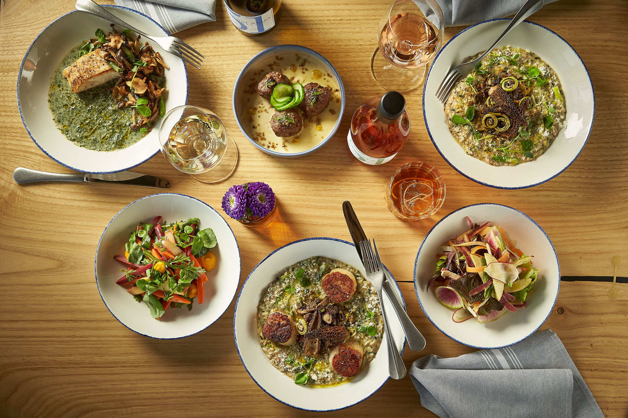 Family style dinner on a table with amaterra wine